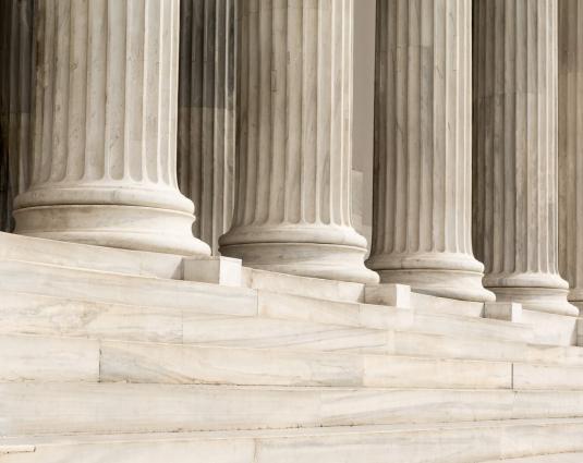 Architectural detail of marble steps and ionic order columns