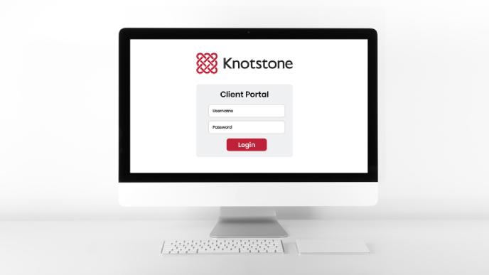 A monitor displaying the Knotstone client portal login page